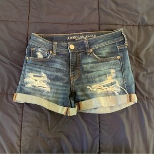 American eagle super super stretch ripped midi dark wash jean shorts